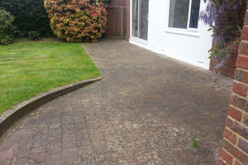 Before Pressure Tech cleaned the patio blockpaving in Chipstead