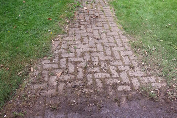 Before Pressure Tech cleaned the tennis court in Sevenoaks