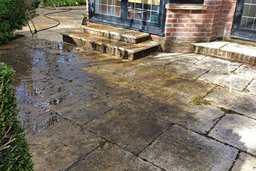 Before Pressure Tech cleaned the patio in Ightham