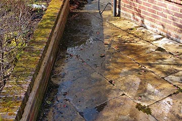 Before Pressure Tech cleaned the patio in Ightham